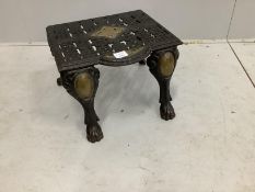 A Victorian brass mounted cast iron footman, width 43cm, depth 39cm, height 30cm
