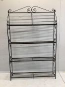 A wrought iron four tier baker's stand, width 127cm, depth 25cm, height 195cm