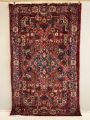 A North West Persian red ground rug, 204 x 150cm