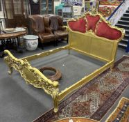 A rococo style giltwood and composition double bedframe from the collection of Raine, Countess