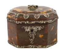 A Victorian silver mounted blond tortoiseshell tea caddy of octagonal form with loop handle and