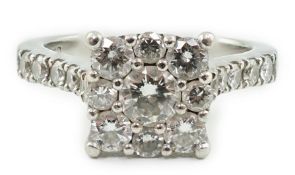 A modern platinum and nine stone diamond set square cluster ring, with ten stone diamond set