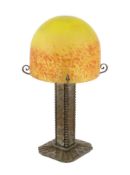 Mulaty, a Continental Arts & Craft wrought iron and marbled glass table lamp, in the manner of Edgar