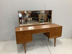 McIntosh of Kirkaldy, a mid century teak kneehole dressing table, width 141cm, depth 46cm, height