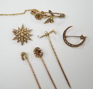 Three early to mid 20th century yellow metal and seed pearl set brooches, largest 34mm, two