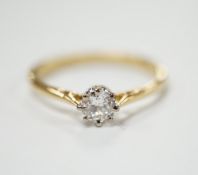 An 18ct and solitaire diamond set ring, size R, gross weight 2.8 grams.