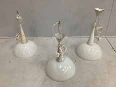 Three 1950's Mathieu Mategot pendant lights with perforated stems and circular opaque glass