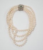 A quadruple strand cultured pearl choker necklace, with emerald and diamond chip set 750 white metal