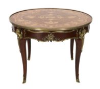 A Louis XVI style ormolu mounted marquetry centre table, decorated with musical, agricultural and