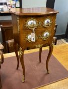A Louis XVI style gilt metal and porcelain mounted small serpentine two drawer chest, width 41cm,