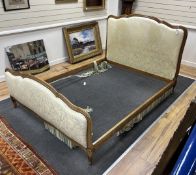 A Louis XVI style upholstered walnut double bedframe, width 156cm, length 220cm, height 123cm.