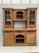 A Victorian style pine dresser with glazed cupboards, width 186cm, depth 68cm, height 203cm