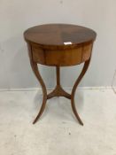 A 19th century Biedermeier mahogany circular work table, diameter 46cm, height 75cm