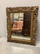 A Florentine style giltwood and composition wall mirror, width 83cm, height 100cm