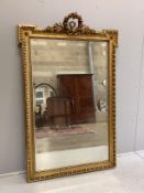 A 19th century French giltwood and composition wall mirror, with floral scroll pediment, width