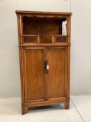 A Chinese carved elm cabinet, width 82cm, depth 55cm, height 182cm