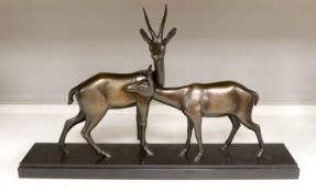 An Art Deco bronzed spelter ‘gazelle’ figure group, 70cm