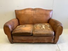 A French leather moustache back sofa, width 148cm, depth 80cm, height 80cm