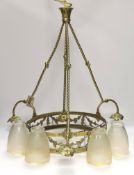 A brass three branch (four light) electrolier and four etched glass shades, 64cm high