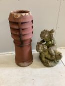 A reconstituted stone fighting cherub garden ornament, height 56cm, together with a terracotta