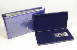 A cased Danbury Mint Queen Elizabeth II Silver Jubilee silver ingot and a Pobjoy Mint 25th
