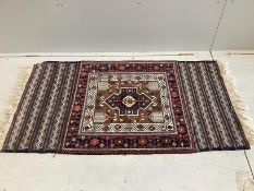 A Turkish polychrome geometric rug, 150 x 85cm