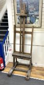 A Victorian oak artist's studio easel, width 60cm