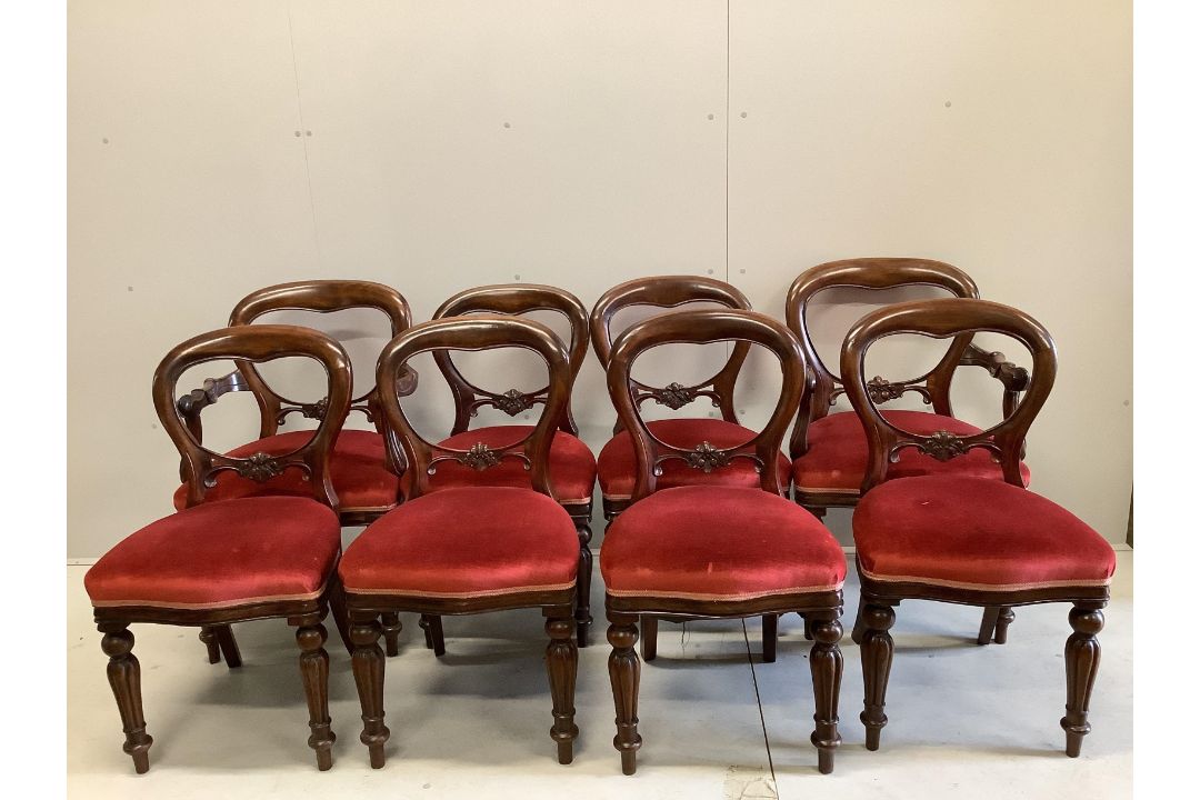 A set of eight Victorian style mahogany balloon back dining chairs, two with arms