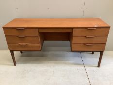 A mid century Europa teak dressing table, width 150cm, depth 45cm, height 73cm