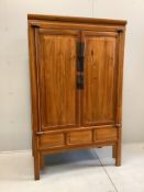A Chinese elm cabinet, width 108cm, depth 60cm, height 177cm