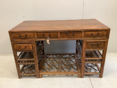 A Chinese elm pedestal desk, width 138cm, depth 68cm, height 83cm