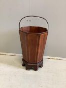 A 19th century octagonal inlaid mahogany waste paper bin, raised on bracket supports, width 26cm,