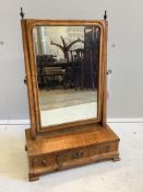 An 18th century walnut veneered dressing table mirror, on plinth fitted with three small drawers,