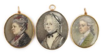 Y English School circa 1800 A set of three portrait miniaturesoil on ivorya gentleman wearing a
