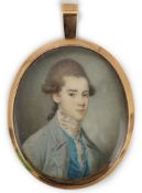 Y English School circa 1800 Portrait miniature of a young manoil on ivorywearing a pale blue coat,