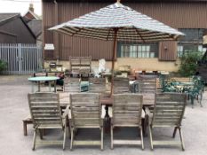 A large rectangular weathered teak extending garden table, width 256cm extended, depth 116cm, height