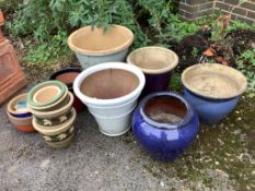 Fifteen assorted glazed earthenware garden pots and planters, largest diameter 50cm, height 44cm