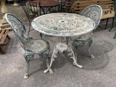 A Victorian style circular painted aluminium garden table, diameter 80cm, height 72cm and two