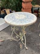 A wrought iron circular tiled top garden table, diameter 70cm, height 76cm