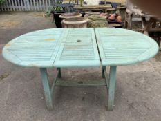 A painted teak extending garden table, width 170cm extended, depth 110cm, height 75cm together
