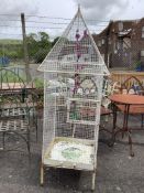 A painted wrought iron and wirework birdcage, width 62cm, height 180cm