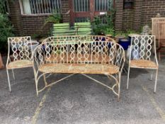 A vintage painted wrought iron four piece garden suite comprising a pair of benches, width 141cm,