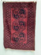Two Afghan red ground rugs, larger 170 x 120cm***CONDITION REPORT***PLEASE NOTE:- Prospective buyers