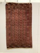 A Tekke Turkoman red ground rug, woven with rows of elephant’s foot motifs, 212 x 122cm***