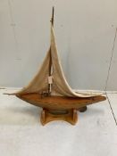 An early 20th century pond yacht on later stand, length 108cm, height including stand 112cm***