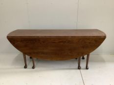 A reproduction 18th century style oak drop leaf wake table, length 194cm, width 150cm extended,