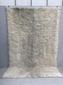 A faux sheepskin carpet, 290 x 200cm***CONDITION REPORT***PLEASE NOTE:- Prospective buyers are