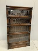 A Globe Wernicke oak four section bookcase with leaded glazed doors, width 86cm, depth 30cm,