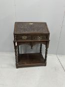 A carved oak bureau, width 68cm, depth 48cm, height 97cm***CONDITION REPORT***PLEASE NOTE:-