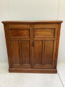 An Edwardian mahogany two door side cabinet, (loose plinth), width 124cm, depth 29cm, height